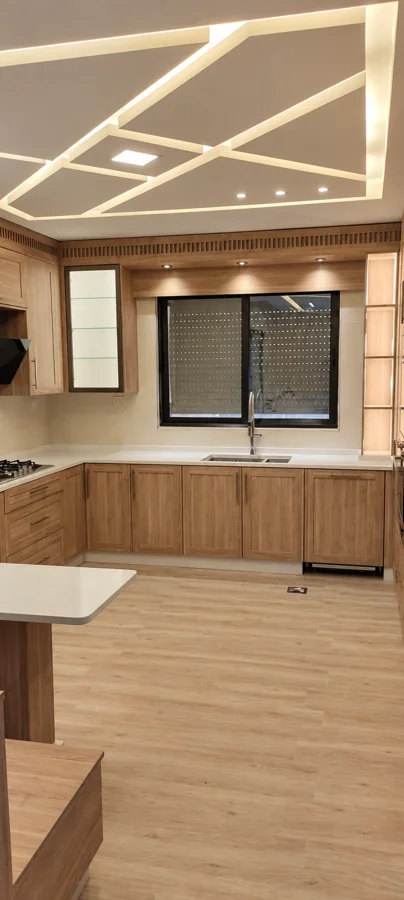 دفء الخشب وتفاصيل مدمجة — Kitchen One
